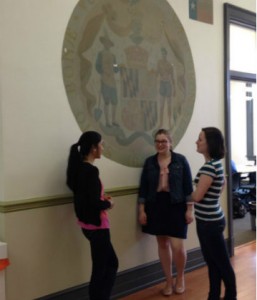 Students Chatting in Front of the Murals in Monroe Hall, 2014 From left to right: Julia Wood, Laura-Michal Balderson, Leah Tams Carly Winfield, "Students Chatting in Monroe Hall," April 3, 2014, Personal Collection of Carly Winfield, University of Mary Washington.